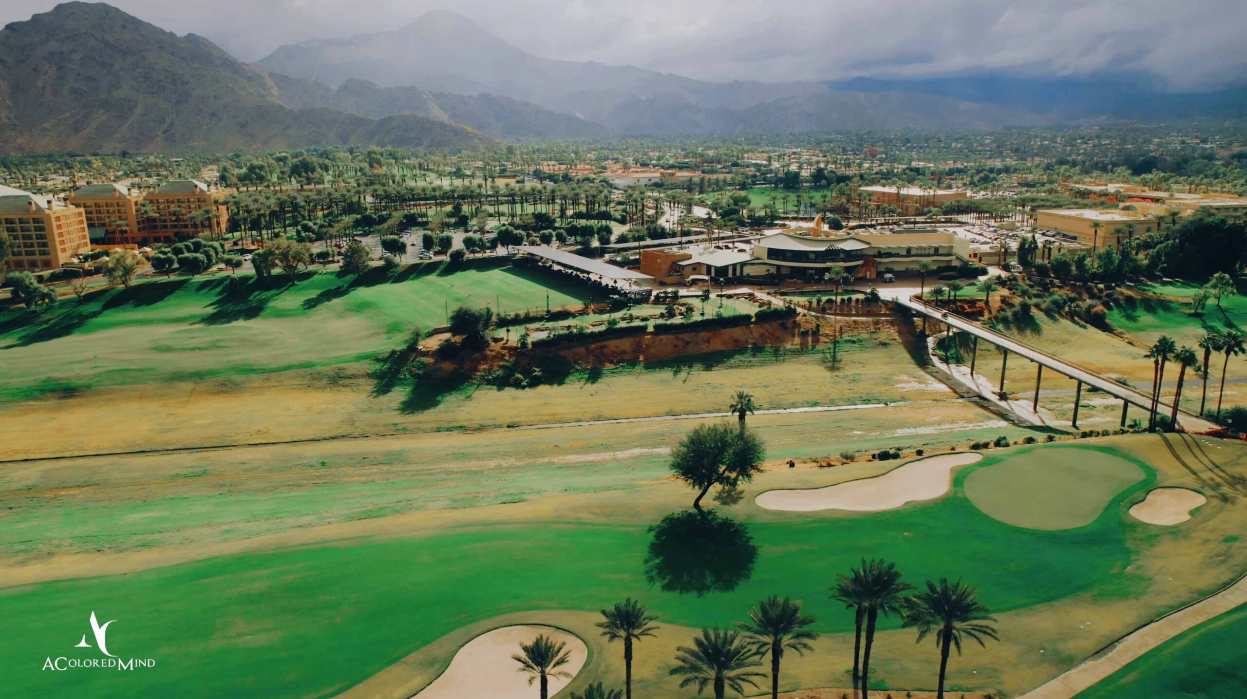 Aerial drone view of Indian Wells Golf Resort and surrounding mountains.