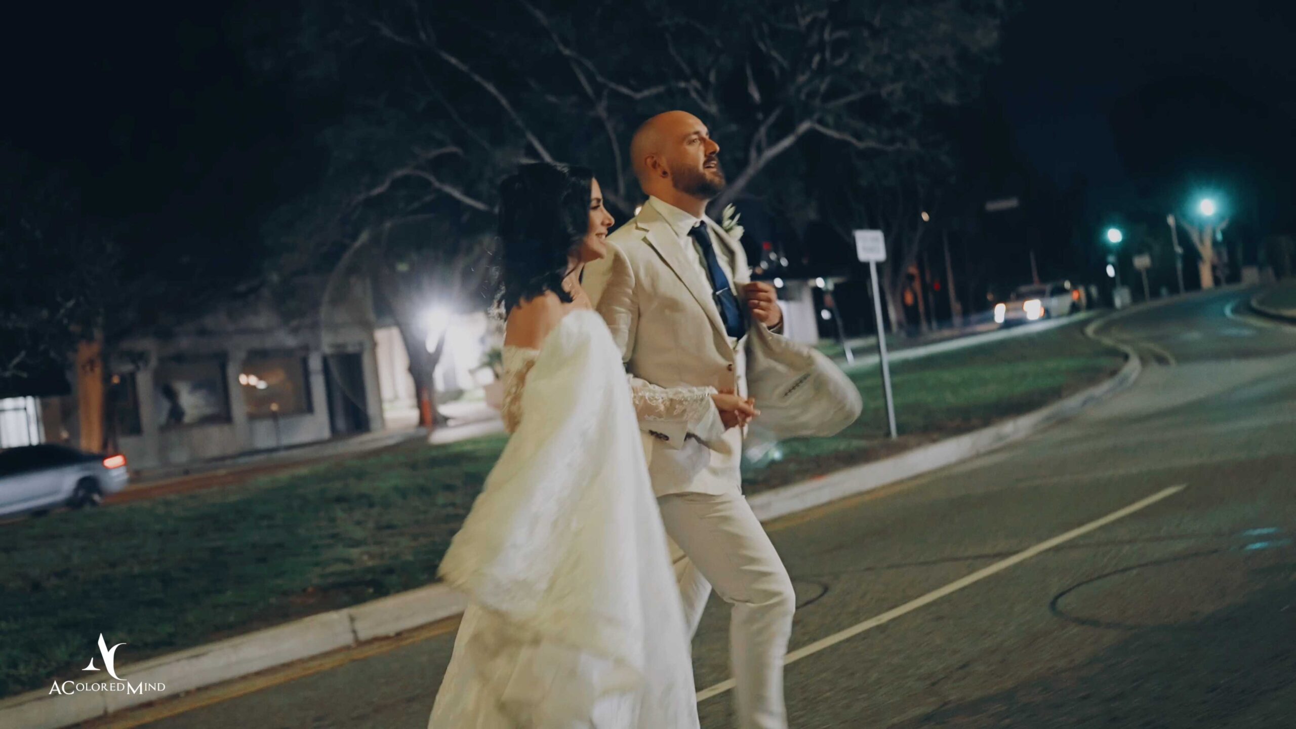 Bride and groom walking outside at night during their Il Cielo Beverly Hills wedding.